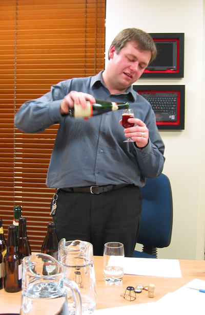 Greig pours another beer